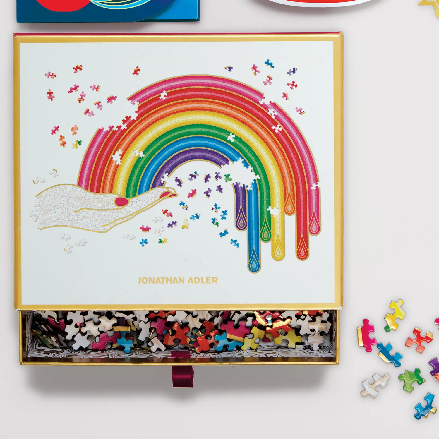 JONATHAN ADLER RAINBOW HAND 750 PIECE SHAPED PUZZLE